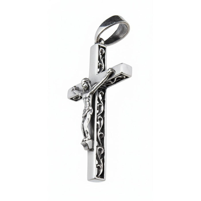 Side profile of 925 sterling silver crucifix pendant showing decorative filigree pattern and bail