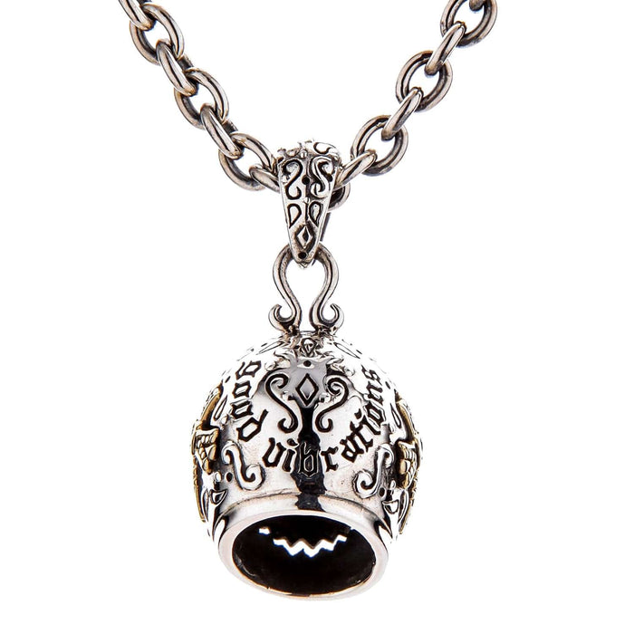 The back of the Mexican mask pendant, showing the "Good Vibrations" engraving and 925 hallmark.