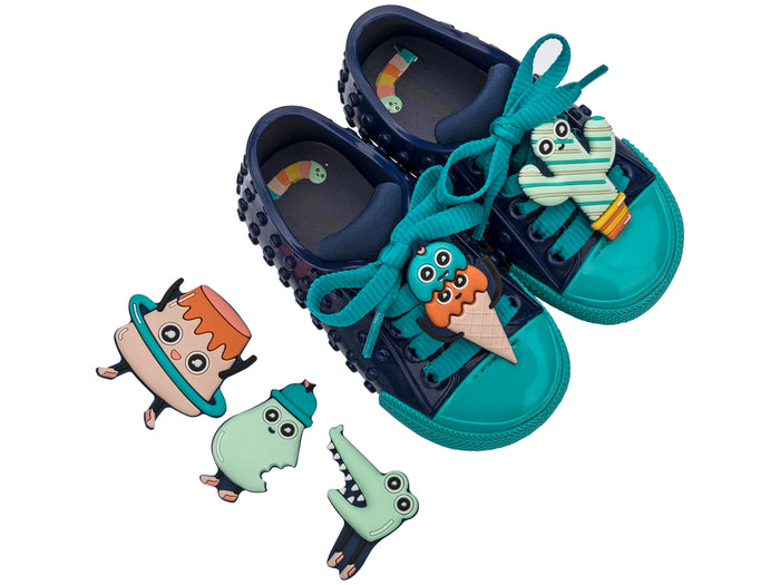Mini Melissa Polibolha Turma Do Pudim Blue Sneakers for Babies – Comfortable and stylish baby sneakers with a playful design, perfect for little feet.