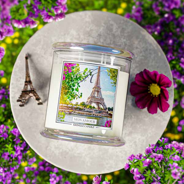 Candle with Eiffel Tower design on a decorative plate with flowers