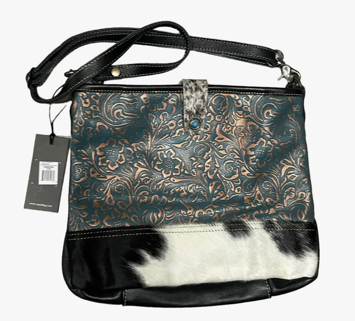 Myra  turquoise and black cowhide leather hand bag with tooled leather.