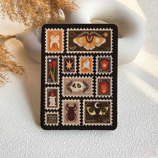 Decorative card with postage stamp designs on a textured surface