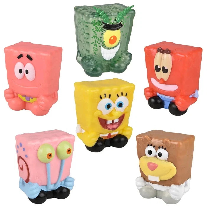 Set of colorful cartoon character figurines on a white background