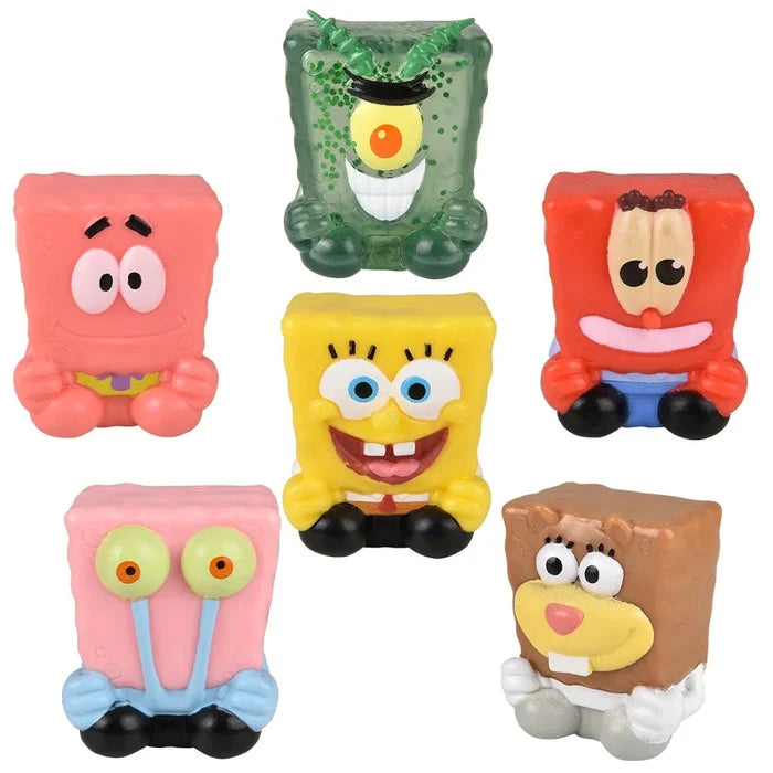 Set of colorful cartoon character figurines on a white background