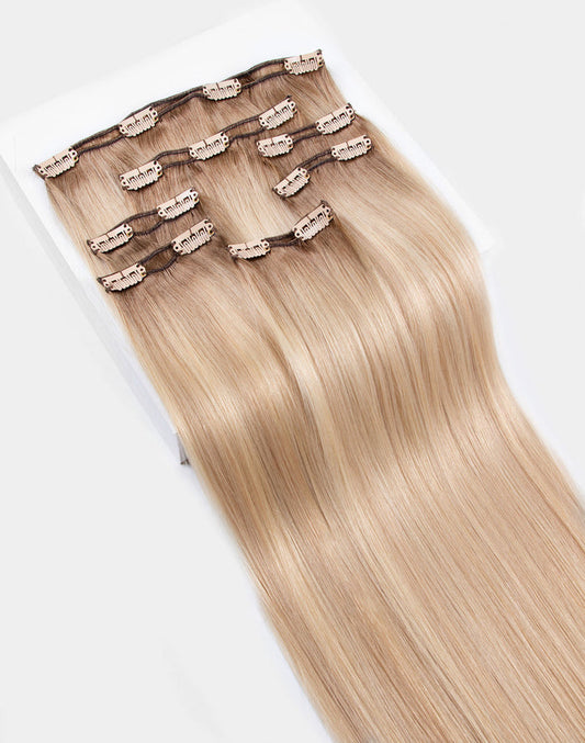 row of pro 7 clip-in® set bundle extensions in blonde