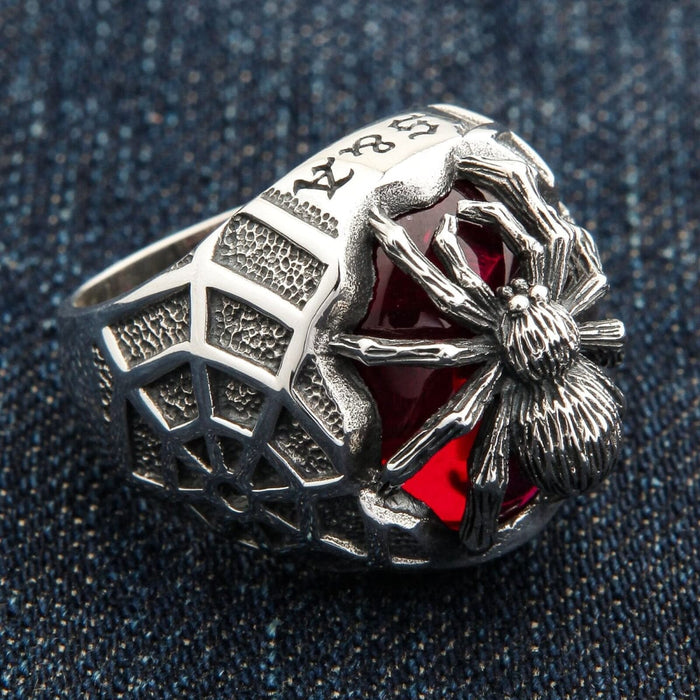 A side profile of the gothic spider ring, showing the small, detailed spider on the band.