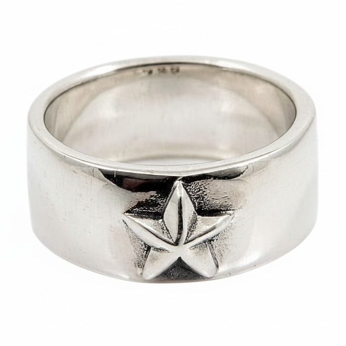 A front view of the sterling silver rock star band ring with a bold five-pointed star emblem, on a white background.
