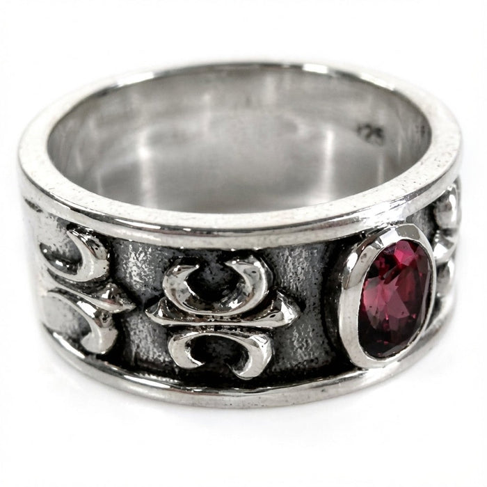 Handcrafted 925 sterling silver men's ruby ring showing ornate side details