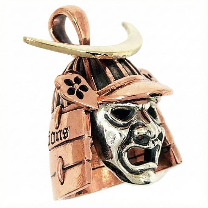 Angled view of Japanese warrior mask pendant with fierce expression