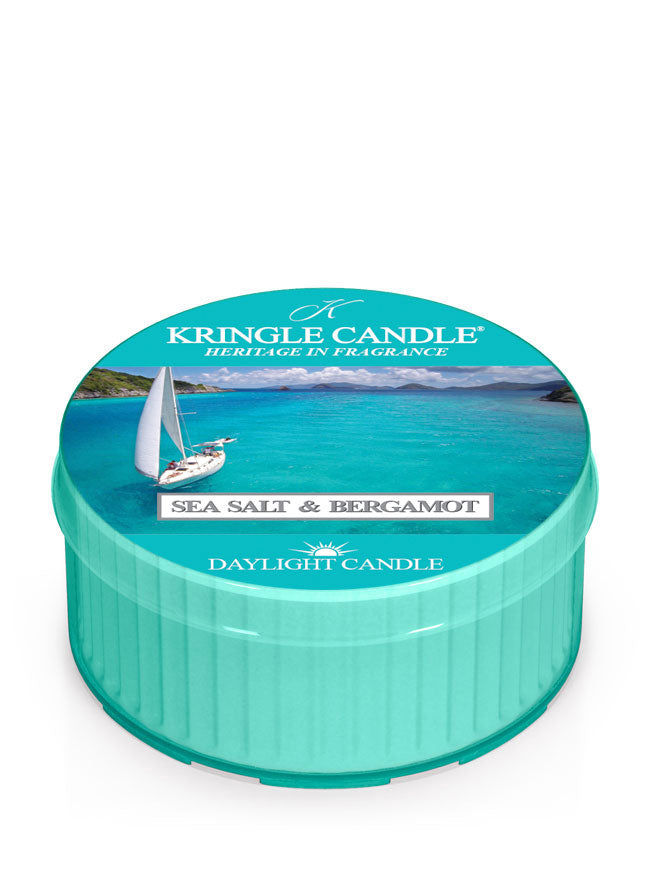 Teal candle tin with ocean scene, sailboat, and text "Kringle Candle, Sea Salt & Bergamot, Daylight Candle."