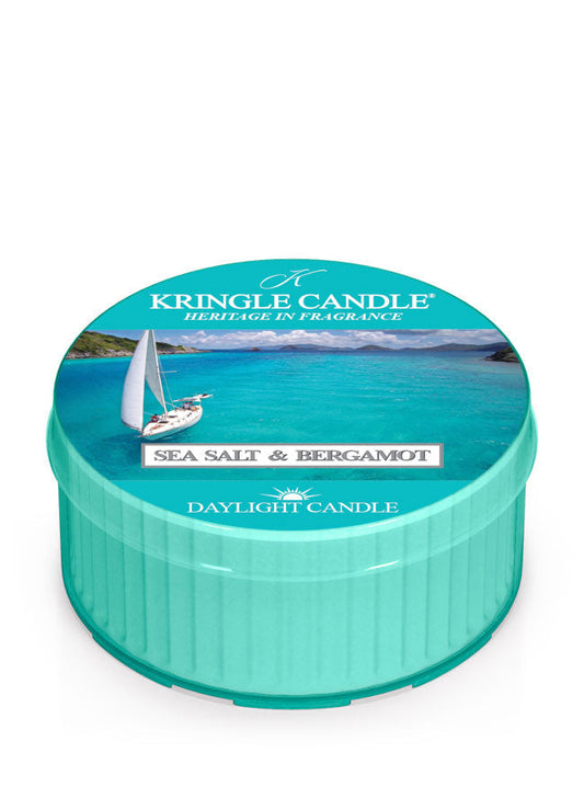 Teal candle tin with ocean scene, sailboat, and text "Kringle Candle, Sea Salt & Bergamot, Daylight Candle."