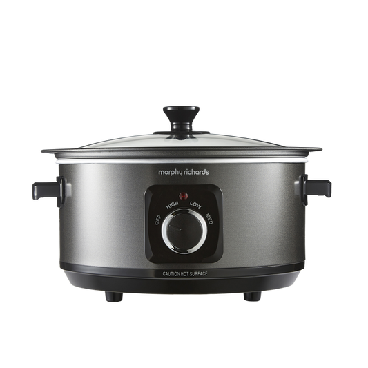 A black Morphy Richards Sear & Stew 6.5L hinged lid slow cooker with a front-facing control dial and two handles.