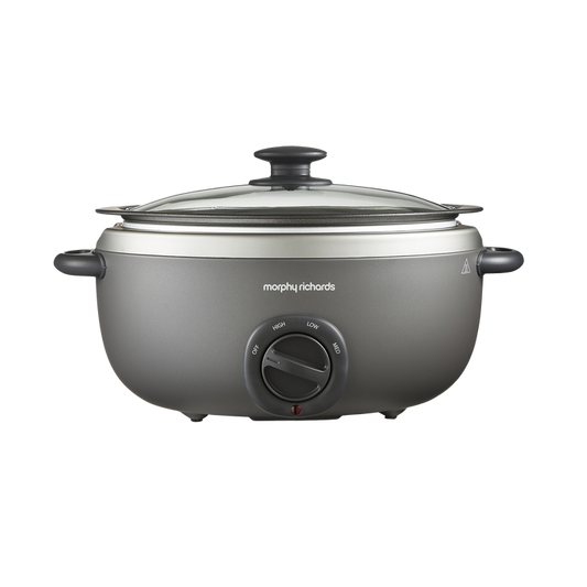A gray Morphy Richards Sear & Stew Oval 6.5L Slow Cooker with a glass lid and a knob on the front.