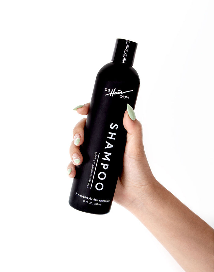 hand holding Shampoo