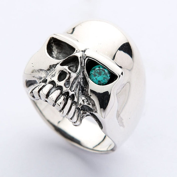 Biker skull ring in sterling silver with blue topaz eye three quarter angle