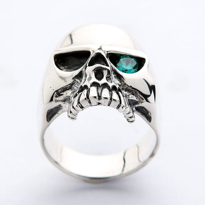 Men's sterling silver skull ring with blue topaz eye straight front view