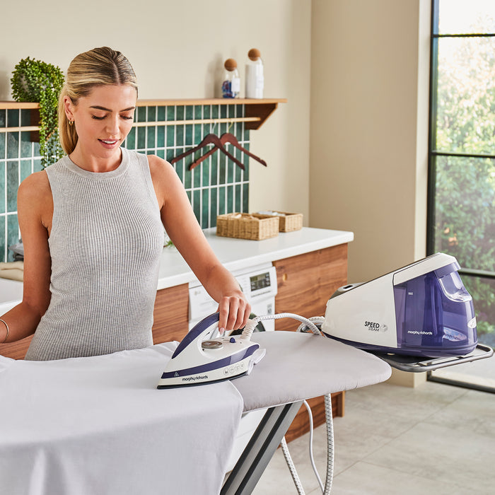 lady ironing in kitchen