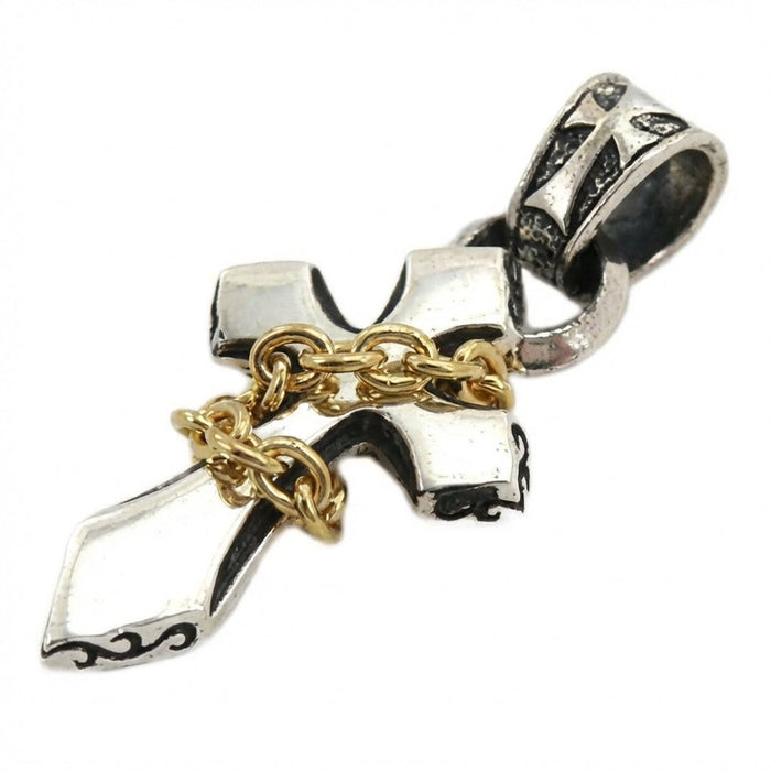 Handcrafted sterling silver cross pendant with wrapped yellow gold chain close-up detail