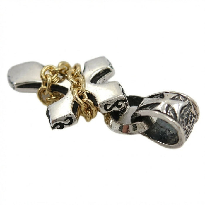 Two-tone sterling silver and yellow gold chain cross pendant side angle view