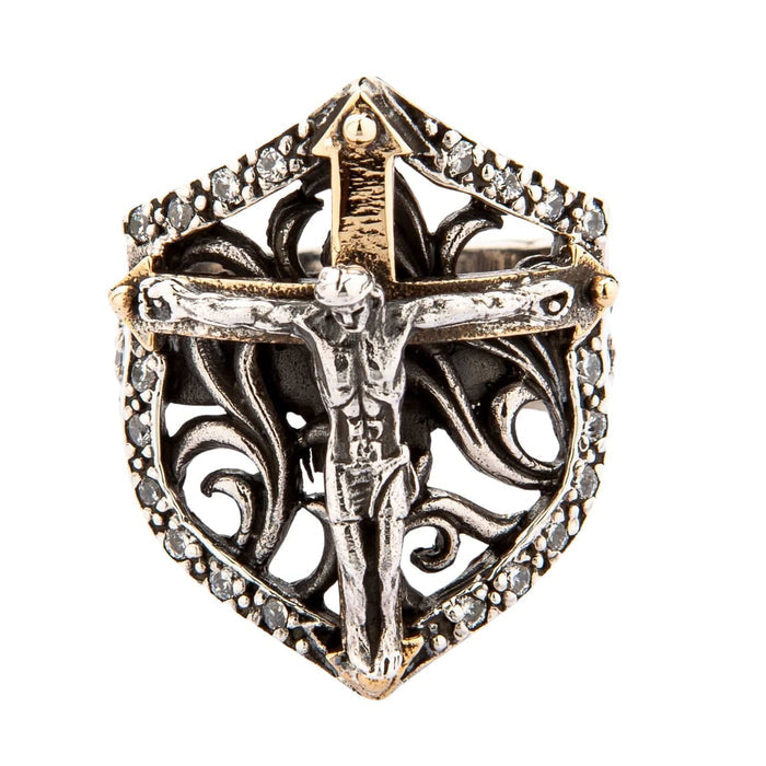 A two-tone Catholic ring featuring the body of Jesus (corpus) on a golden cross.