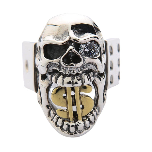 A front view of the men's sterling silver dollar sign skull ring, showing the gold dollar sign in its mouth and a clear crystal eye.