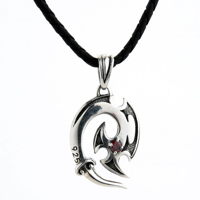 Full view of sterling silver tribal hook pendant necklace with red garnet on black leather cord