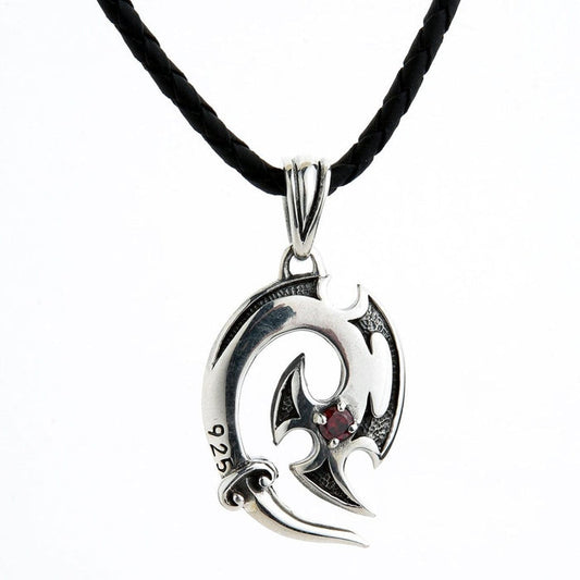 Full view of sterling silver tribal hook pendant necklace with red garnet on black leather cord