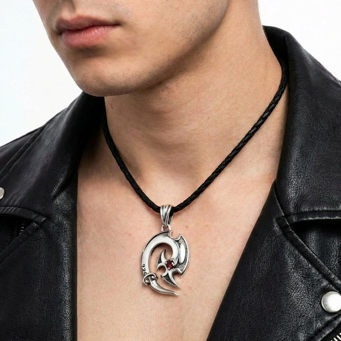 Man wearing sterling silver tribal hook pendant necklace with leather jacket