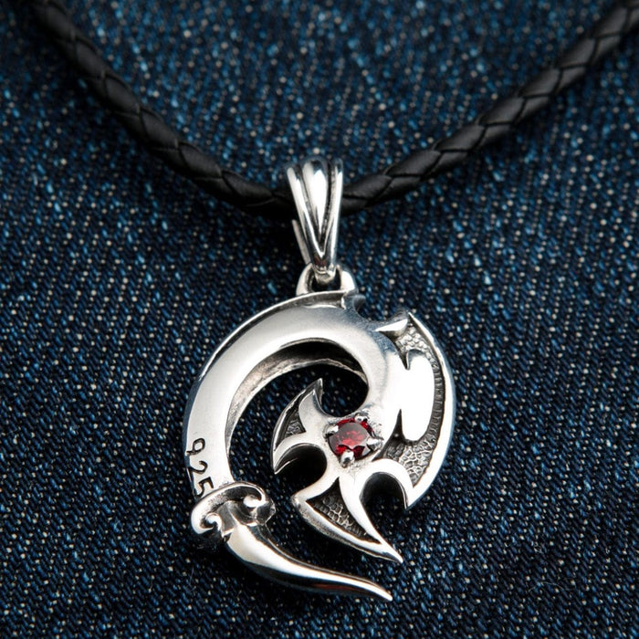 Handcrafted 925 sterling silver tribal pendant with intricate design and red gemstone accent