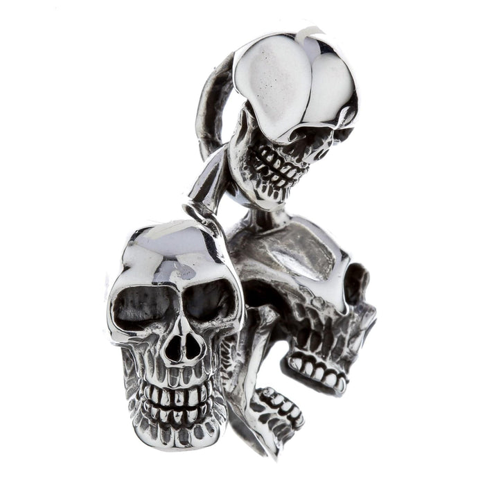 An angled view of the gothic multi-skull pendant, showing the different laughing and grinning expressions.