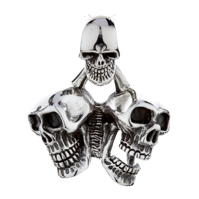A front view of the heavy sterling silver triple skull pendant with a third skull as the bail.