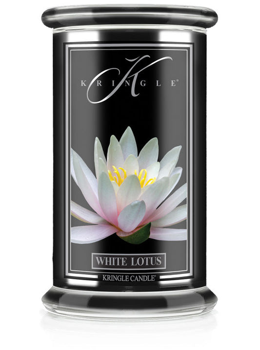 A candle jar labeled "White Lotus" with an image of a blooming white lotus flower on a black background.