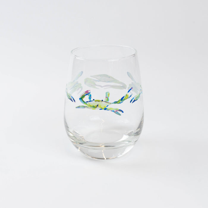 Wine glass with crab pattern against white background