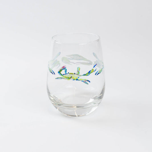 Wine glass with crab pattern against white background