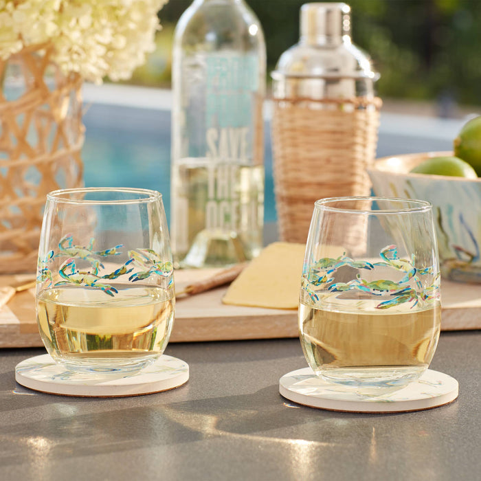 Wine glass with crab pattern on a dining table
